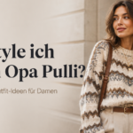 Frau trägt einen gemusterten Opa-Pulli mit beiger Stoffhose im modernen Grandpa-Core-Look